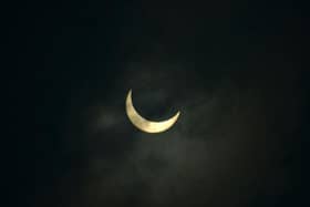 The moon partially covers the sun during an annular solar eclipse in June 2020. (Photo: Diptendu DUTTA / AFP)