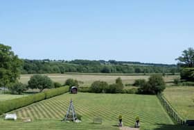 The house is surrounded by grounds and parkland