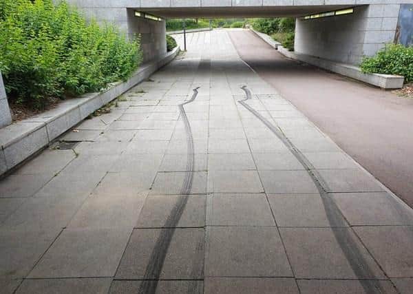 Skid marks left behind under a city underpass