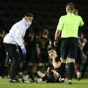 Simon Crampton gives treatment to Scott Fraser