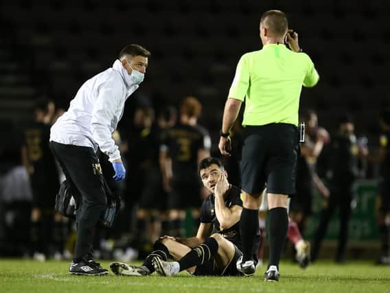 Simon Crampton gives treatment to Scott Fraser