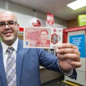 Bletchley Postmaster Ahmed Butt with the new note