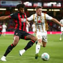 Tyrone Mings takes on Rhys Healey when Dons and Bournemouth last met