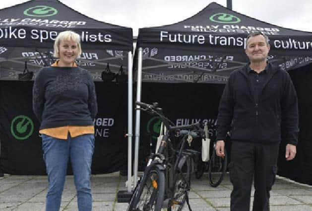 Cllr Jenny Wilson-Marklew  hands over an eBike to MK’s first new loanee, Geof