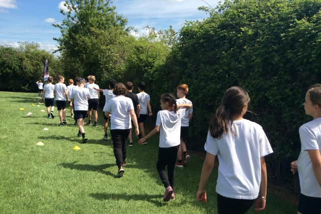 Pupils walked or ran around the school field