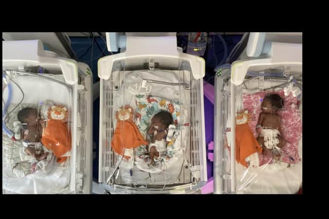 The triplets in their incubators