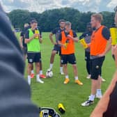 Dean Lewington leads training for MK Dons