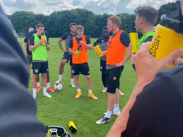 Dean Lewington leads training for MK Dons