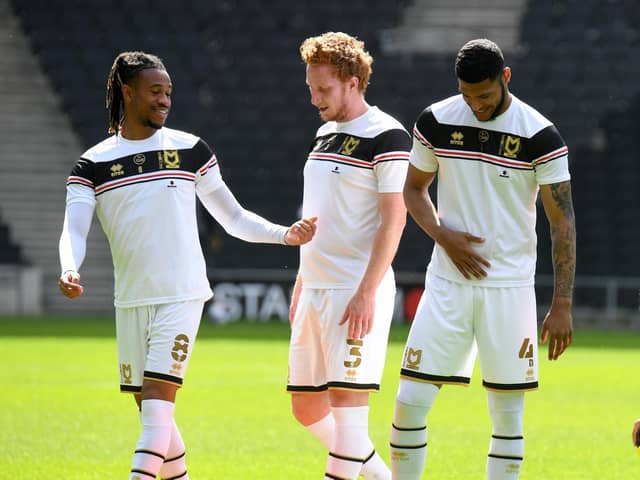 Dean Lewington will take charge of Dons for Bolton on Saturday