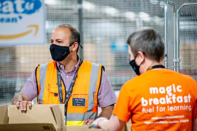 MK Amazon workers pack up the breakfast boxes