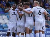 Peter Kioso leads the celebrations at Gillingham