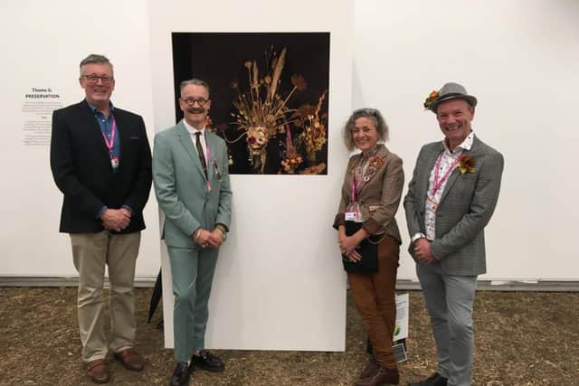 Theresa is pictured being congratulated by the judges, and the UK's finest floral designers including from left, Shane Connolly, Simon Lycett and Jonathan Moseley.
Photo by Karen Parker