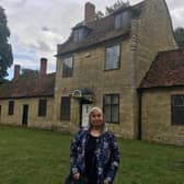 Labour ward councillor Hannah Minns outside the almshouses