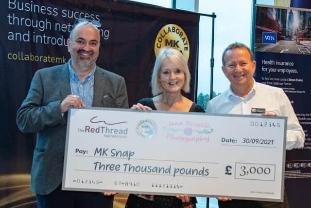 Presenting the cheque to MK SNAP. From left to right: Tim Lee of Collaborate MK, Jane Russell, freelance photographer and Freddie Guilmard from The Red Thread Partnership.
