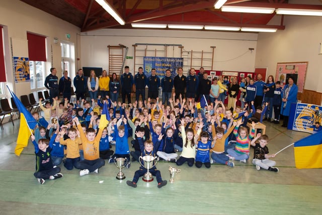 Pupils at Hollybush Primqry School celebrating Steelstown Brian Ogs' All Ireland Intermediate Club success. (Photo: Jim McCafferty)
