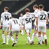 MK Dons lost ground on the automatic promotion places after a poor defeat at Grimsby Town.