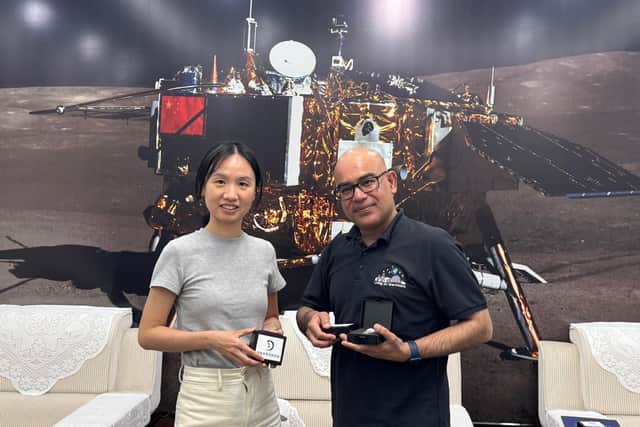 Professor Anand receives the samples during a visit to China
