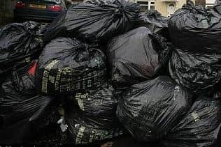 The mountain of black sacks is gorwing every day