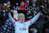 A young MK Dons fan looks on during the FA Cup with Budweiser Second Round match between MK Dons and AFC Wimbledon at StadiumMK on December 2, 2012.