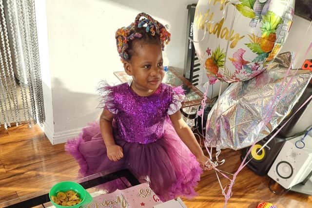 Rebecca wore a designer dress and shoes to nursery