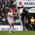 Milton Keynes Dons are being given a 20% chance of making the League Two play-offs.