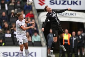 Milton Keynes Dons are being given a 20% chance of making the League Two play-offs.