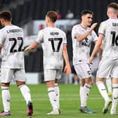MK Dons celebrate Conor Grant's goal against Sutton United on Tuesday night at Stadium MK. The only goal of the game ensured Dons' name goes into the hat for Wednesday night's draw.