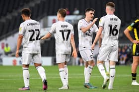 MK Dons celebrate Conor Grant's goal against Sutton United on Tuesday night at Stadium MK. The only goal of the game ensured Dons' name goes into the hat for Wednesday night's draw.