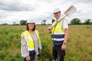 Bellway's Senior Sales Manager Lindsey Davenport and Contracts Manager Peter Bourne putting the first spade in the ground at Bellway’s Whitehouse Park development in MK