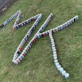 The city's Food Bank is attempting to smash the world record for the longest line of cans in Milton Keynes today (Monday)