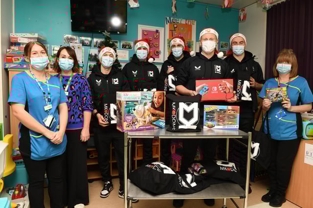 Members of the first team visited Milton Keynes Hospital on Thursday to hand out presents