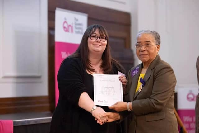 Sue Webb, left, Clinical Lead Admiral Nurse, one of the city council’s specialist dementia nurses receives her award from Dame Elizabeth Anionwu