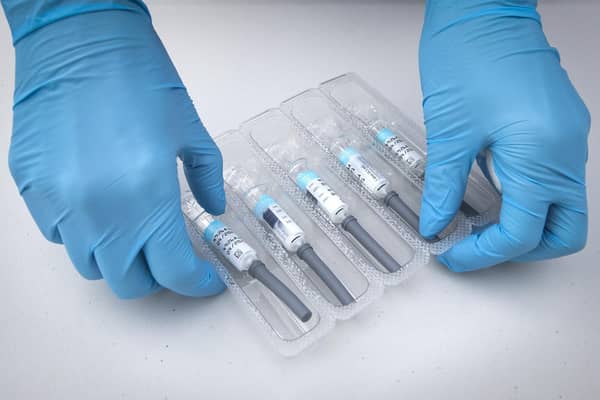 File photo dated 26/09/2020 of a nurse preparing flu vaccine jabs.