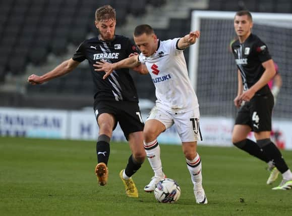 Milton Keynes Dons are currently six points off the play-off places,