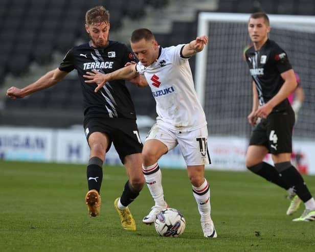 Milton Keynes Dons are currently six points off the play-off places,