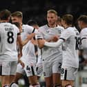 MK Dons are likely to look more familiar when they return to League Two action on Saturday, but there may be a chance for some of Tuesday's top performers to feature against Salford City. Here is our line-up prediction