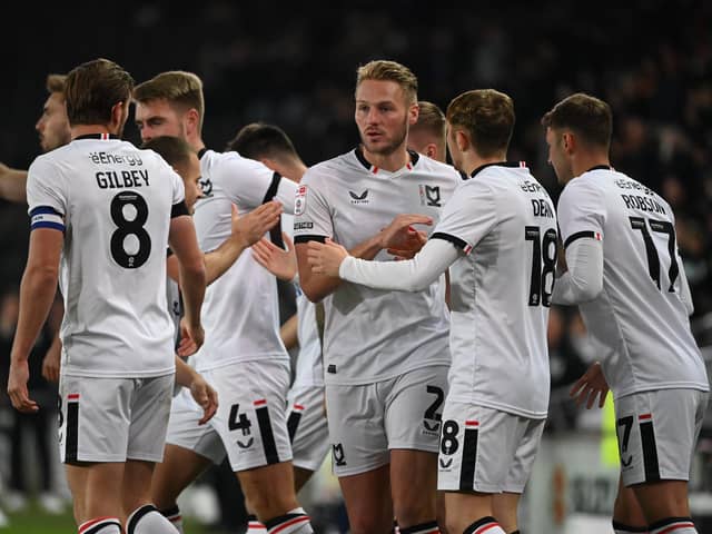 MK Dons are likely to look more familiar when they return to League Two action on Saturday, but there may be a chance for some of Tuesday's top performers to feature against Salford City. Here is our line-up prediction