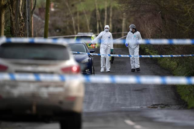 OMAGH, NORTHERN IRELAND - FEBRUARY 23: Police and forensics are seen at the scene of last nights shooting of a high profile PSNI officer at the Youth Sports Centre on February 23, 2023 in Omagh, Northern Ireland. The senior police officer, named as Detective Chief Inspector John Caldwell was shot four times as he put footballs into the boot of his car as he stood along side his son following a football training session. The PSNI have said that the "primary focus" of the police investigation is the involvement of violent dissident republicans. (Photo by Charles McQuillan/Getty Images)