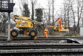 Workers put the final touches on the new rail track at Bletchley