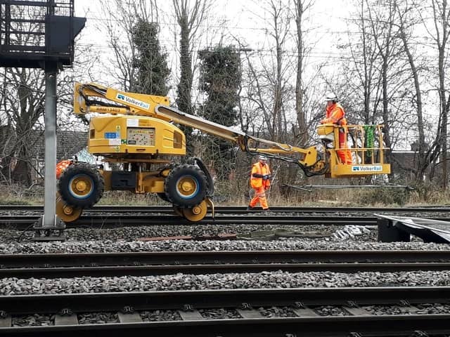 Workers put the final touches on the new rail track at Bletchley