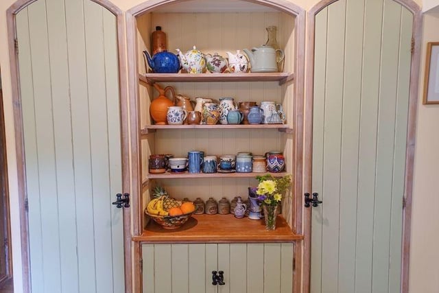 This inset shelving display unit is one of the many delightful features of this period property