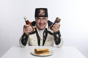 'I ever did a PhD in anything, it would be indolence': Danny Baker with a sausage sandwich (photo: Steve Ullathorne)