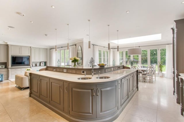 The dream kitchen flooring features hand painted handmade kitchen and units, range/duel microwave ovens/warming drawers/full height fridge/full height freezer, Quooker tap, dishwasher and all the extras one would expect.