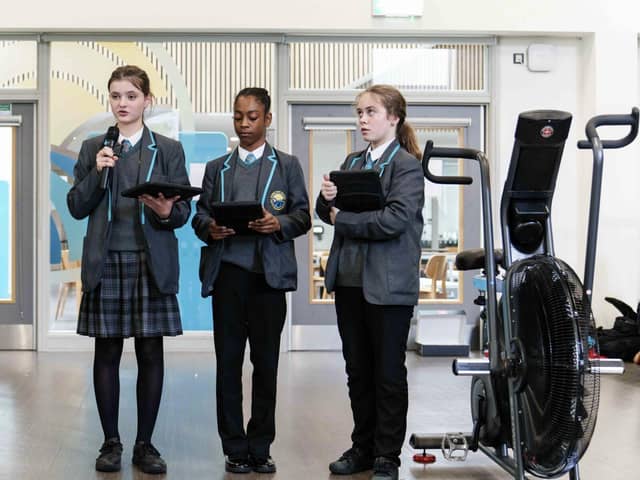 Students present their winning design of an electro bike to generate renewable kinetic energy