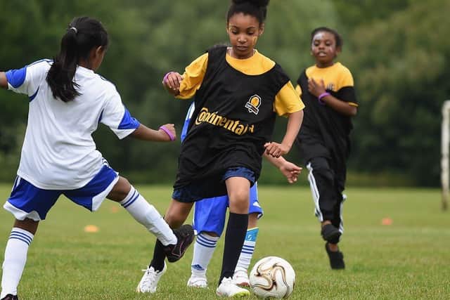 Councillors are calling for girls football to be made mandatory in schools