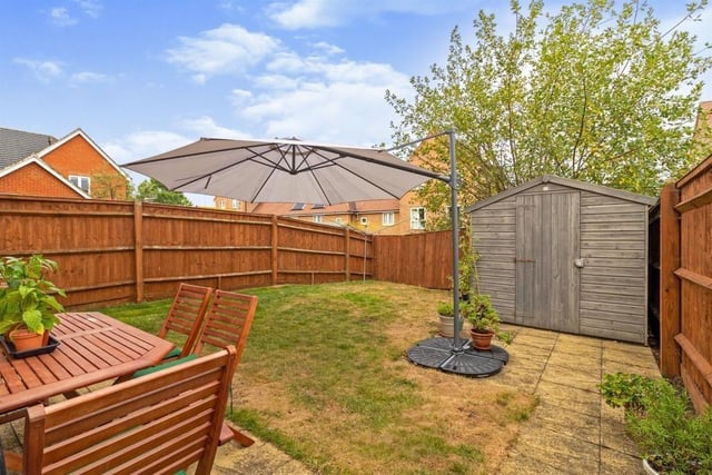 Rear Garden is laid mainly to lawn with paved patio area, and gated side access