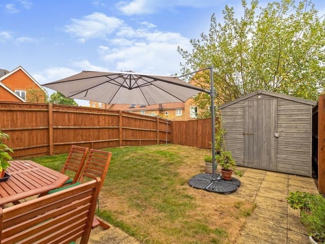 Rear Garden is laid mainly to lawn with paved patio area, and gated side access