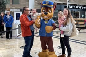 Shoppers take a 'paws' to greet larger-than-life character Chase.