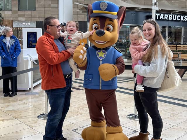 Shoppers take a 'paws' to greet larger-than-life character Chase.