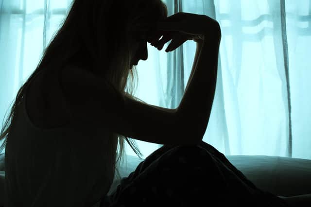 File image of the silhouette of a woman.